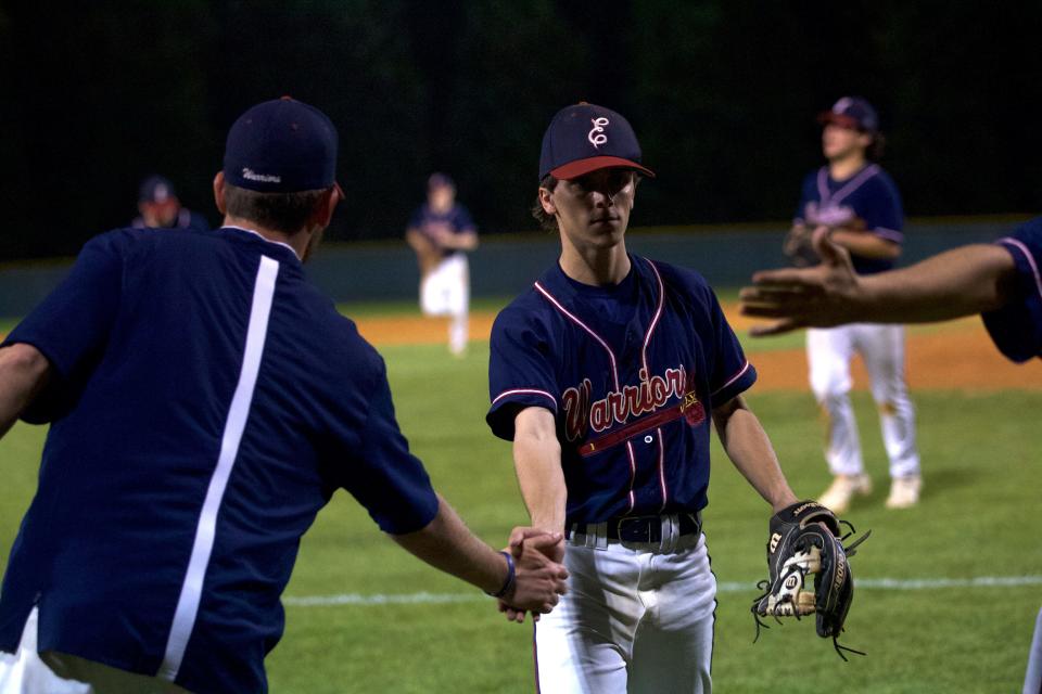 East Gaston's Parker Agosta is congratulated as he walks back to the dugout during his team's April 6, 2022 game against Cherryville.
