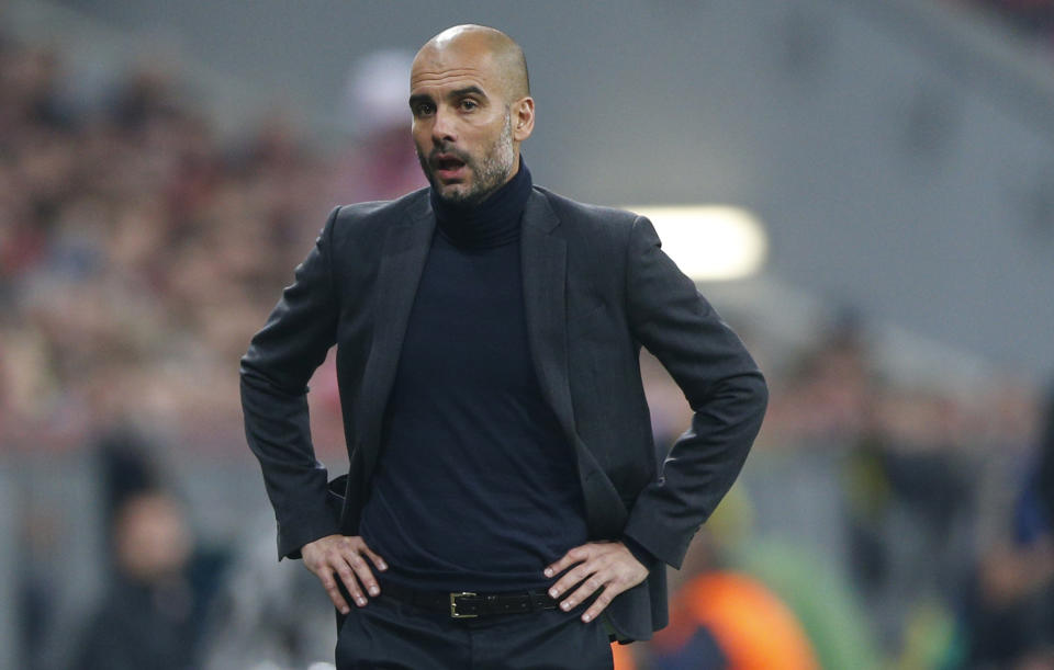 Bayern head coach Pep Guardiola watches during the Champions League semifinal second leg soccer match between Bayern Munich and Real Madrid at the Allianz Arena in Munich, southern Germany, Tuesday, April 29, 2014. (AP Photo/Matthias Schrader)