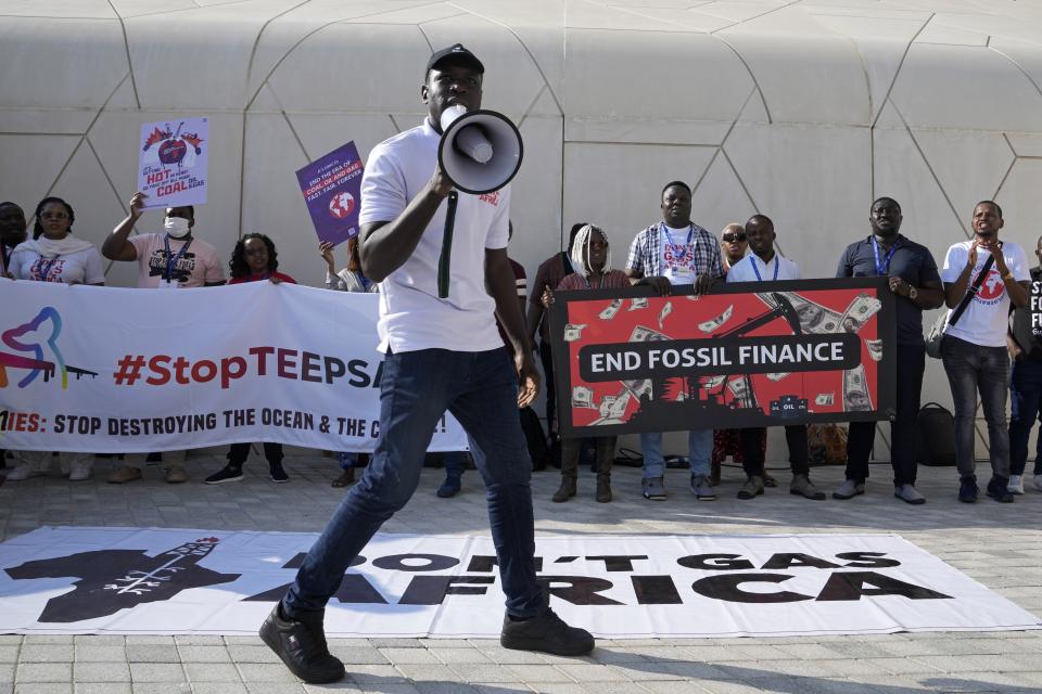 Activists demonstrate against fossil fuels at the COP28 U.N. Climate Summit, Sunday, Dec. 10, 2023, in Dubai, United Arab Emirates. (AP Photo/Kamran Jebreili)