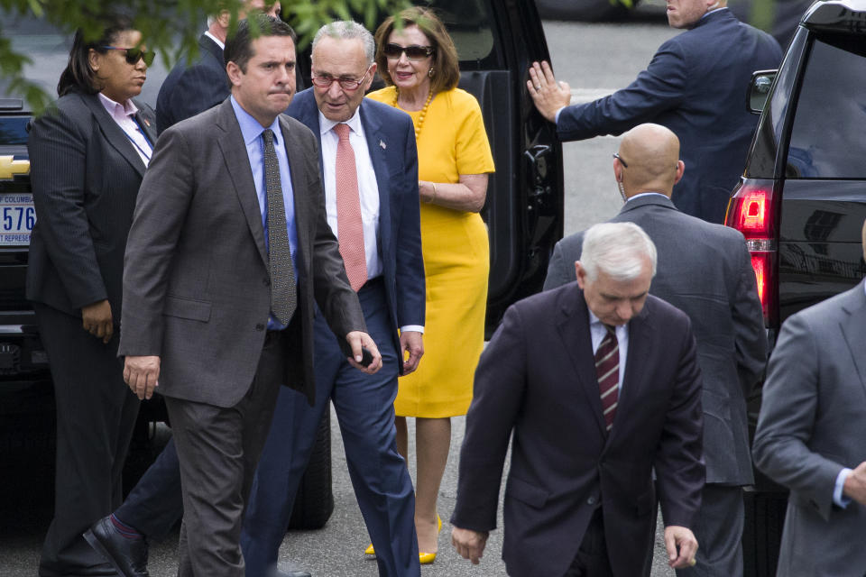 Rep. Devin Nunes, R-Calif., ranking member of the House Intelligence Committee, second from left, Senate Minority Leader Chuck Schumer of N.Y., House Speaker Nancy Pelosi of Calif., Sen. Jack Reed, D-R.I., foreground, and others depart after a meeting with President Donald Trump about Iran at the White House, Thursday, June 20, 2019, in Washington. (AP Photo/Alex Brandon)