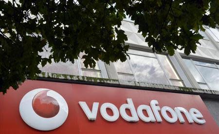 Vodafone branding is seen outside a retail store in London November 12, 2013. REUTERS/Toby Melville