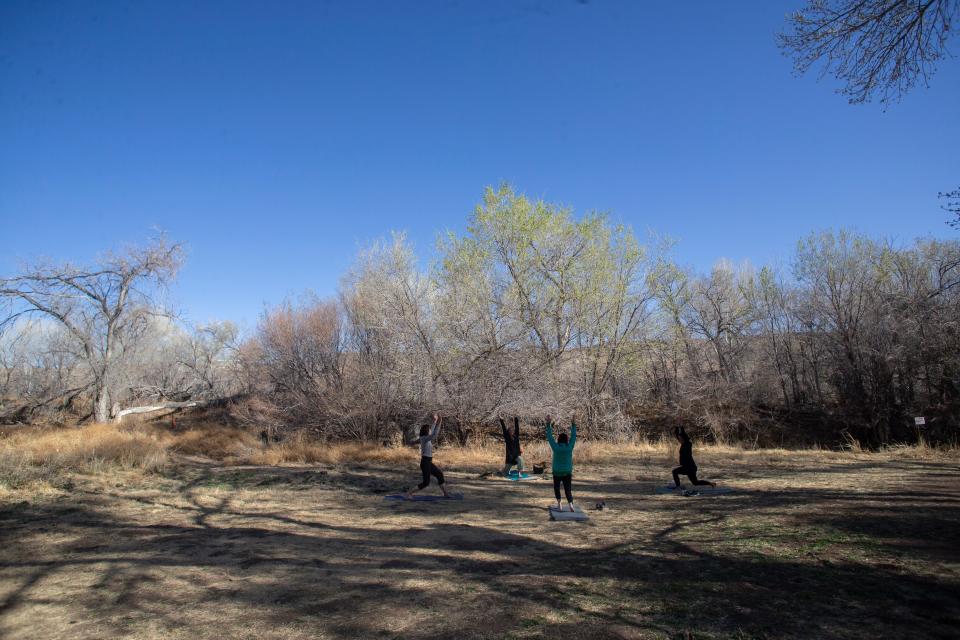 Community members of Hillsboro, N.M., partake in morning yoga at the Black Range Museum Public Park. Area residents got their COVID-19 vaccination the same day thanks to a mobile vaccination unit sent by the New Mexico Department of Health.