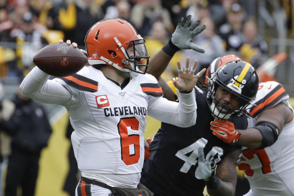 Cleveland Browns quarterback Baker Mayfield (6) passes as he is pressured by Pittsburgh Steelers outside linebacker Bud Dupree (48) in the first half of an NFL football game Sunday, Dec. 1, 2019, in Pittsburgh. (AP Photo/Gene J. Puskar)