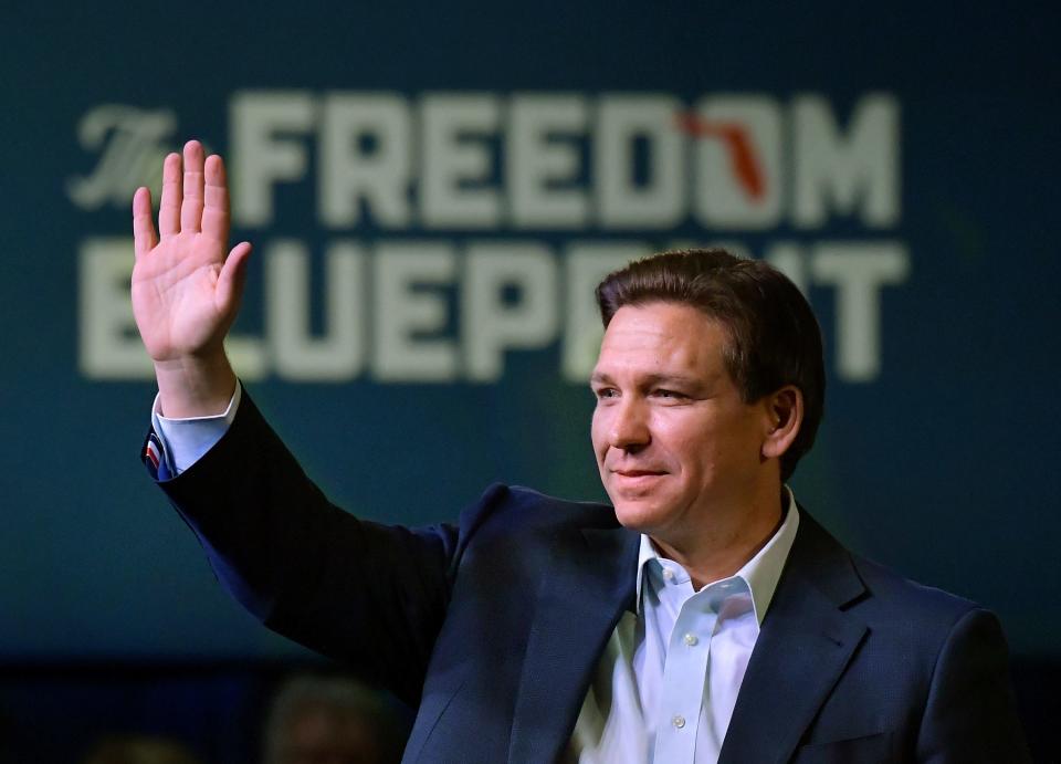 Florida Gov. Ron DeSantis waves to the crowd as he attends an event Friday, March 10, 2023, in Davenport, Iowa.