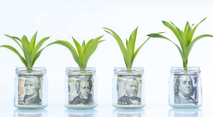 Jars of money with green growth sprouts. hyper-growth stocks