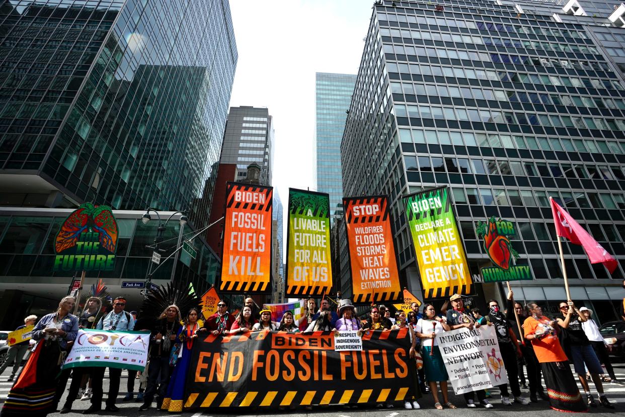 Climate activists block traffic on Park Avenue during a march protesting energy policies and the use of fossil fuels on Sunday in New York.