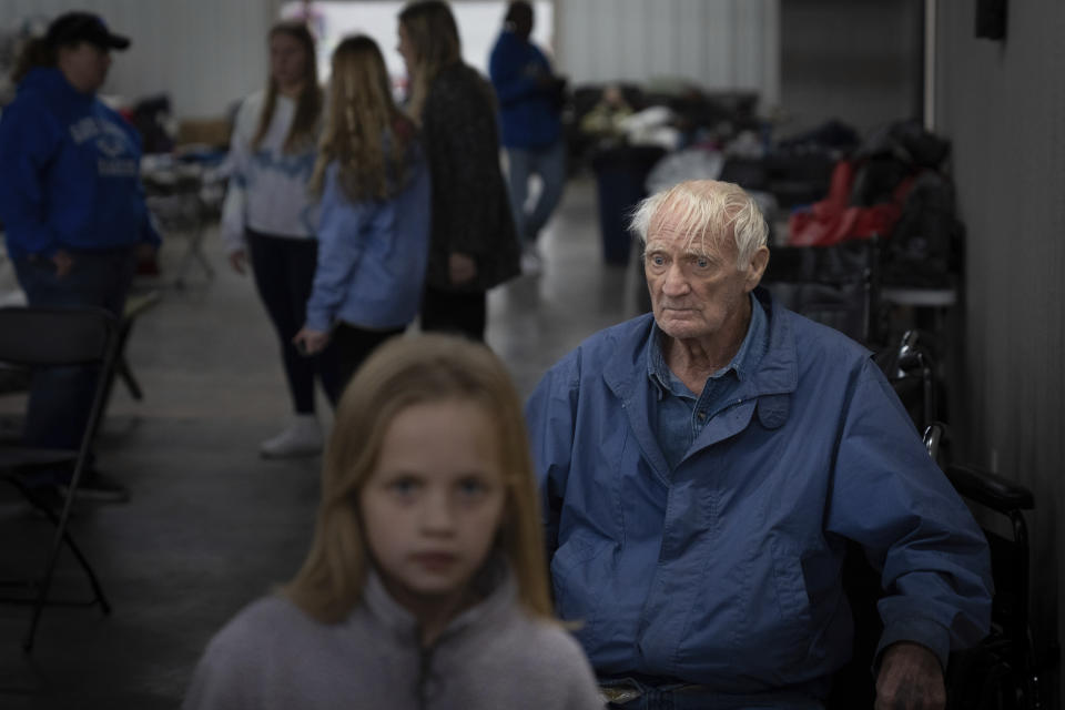 Ronald Hayes sits in a shelter in Wingo, Ky., on Sunday, Dec. 12, 2021, after his home was destroyed by a tornado that ripped through the town on the evening of Dec. 10, 2021. (AP Photo/Robert Bumsted)