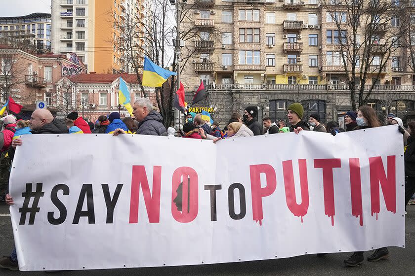 Ukrainians attend a rally in central Kyiv on Saturday.