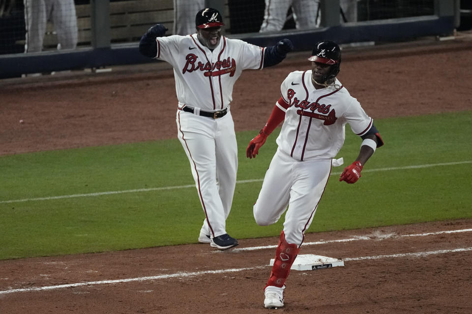 Atlanta Braves' Jorge Soler celebrates a home run during the seventh inning in Game 4 of baseball's World Series between the Houston Astros and the Atlanta Braves Saturday, Oct. 30, 2021, in Atlanta. (AP Photo/John Bazemore)