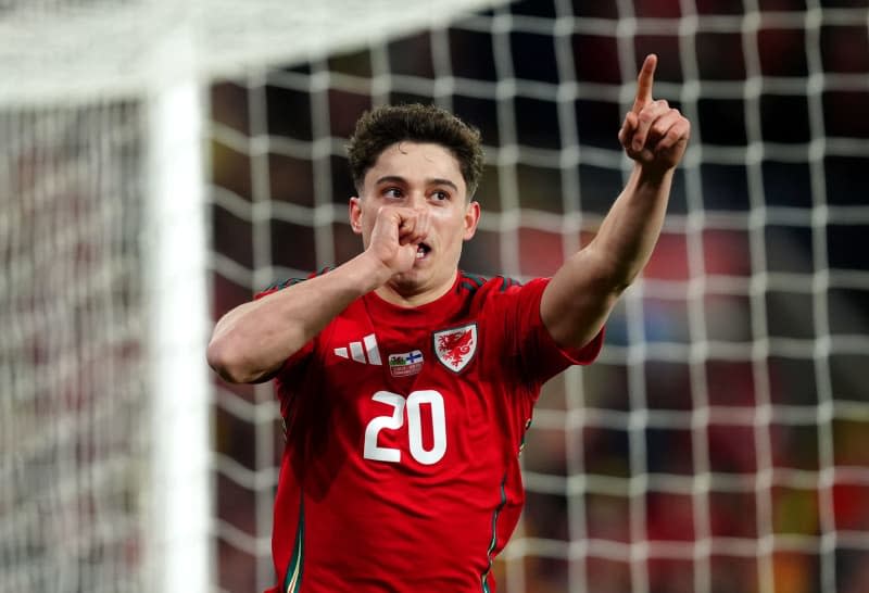 Wales' Daniel James celebrates scoring his side's fourth goal during the UEFA Euro 2024 Qualifying play-off soccer match between Wales and Finland at the Cardiff City Stadium. David Davies/PA Wire/dpa