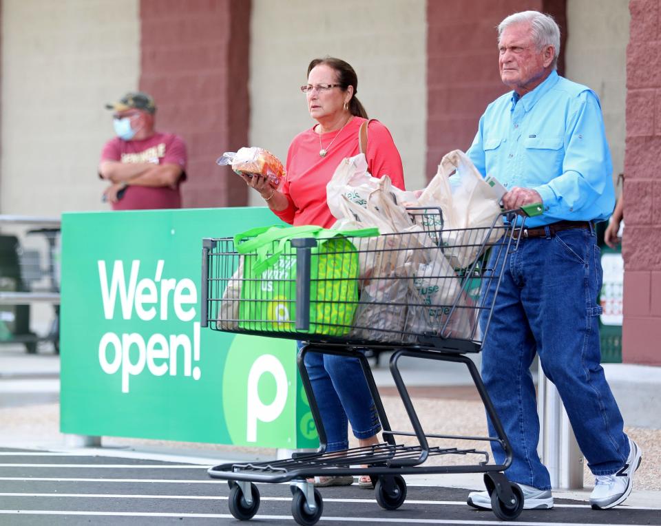 Shoppers exit the new Publix in Crawfordville, Fla. on its opening day on Thursday, Aug. 4, 2022. 