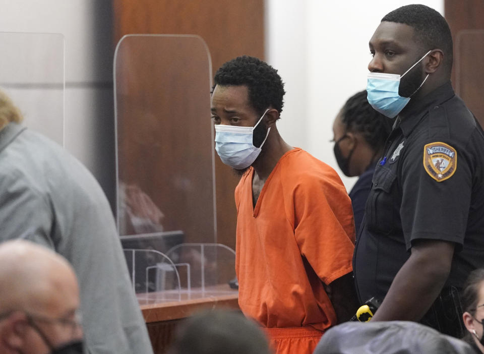 FILE - Tony D. Earls is escorted from the Harris County 263rd District Criminal Court Thursday, Feb. 17, 2022, in Houston. Earls, who is accused of fatally shooting a 9-year-old girl when he was robbed at a Houston ATM in 2022, has been indicted Tuesday, April 23, 2024, for murder in her death. The indictment comes nearly two years after another grand jury had declined to indict him in the death of Arlene Alvarez. (Melissa Phillip/Houston Chronicle via AP, File)