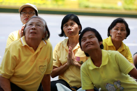 People watch a screening of King Maha Vajiralongkorn being crowned during his coronation in Bangkok, Thailand, May 4, 2019. REUTERS/Soe Zeya Tun