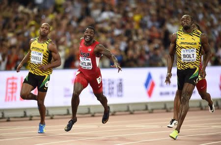 Usain Bolt of Jamaica crosses the finish line first to win the men's 100 metres final at the 15th IAAF World Championships at the National Stadium in Beijing, China August 23, 2015. REUTERS/Dylan Martinez