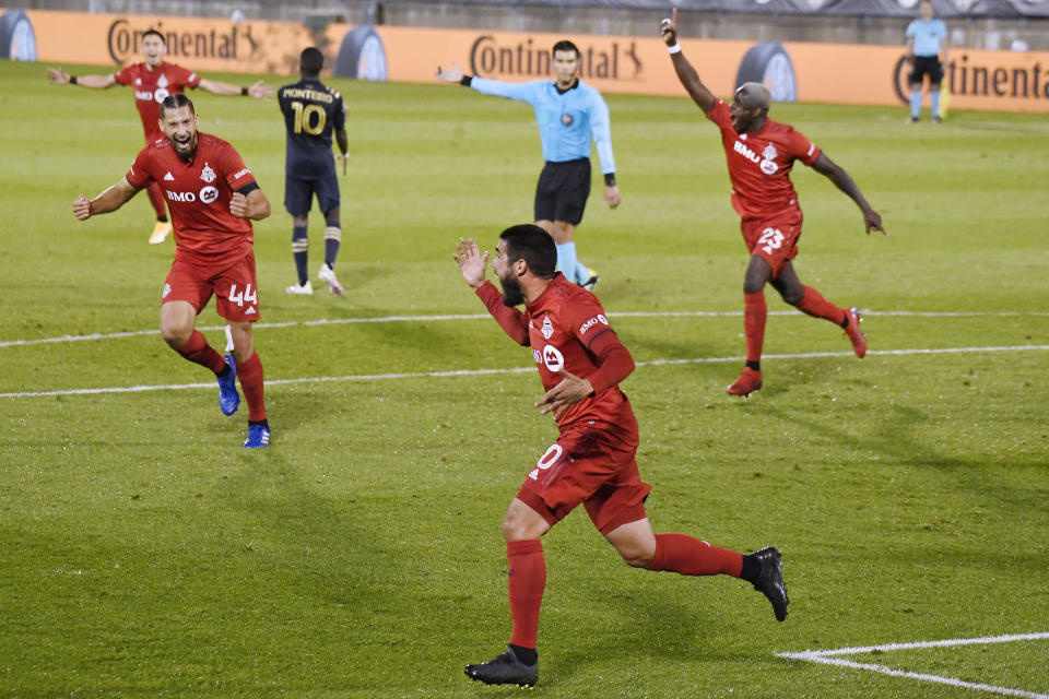 Toronto FC's Alejandro Pozuelo, front center, celebrates his goal with his teammates during the second half of an MLS soccer match against the Philadelphia Union, Saturday, Oct. 3, 2020, in East Hartford, Conn. (AP Photo/Jessica Hill)