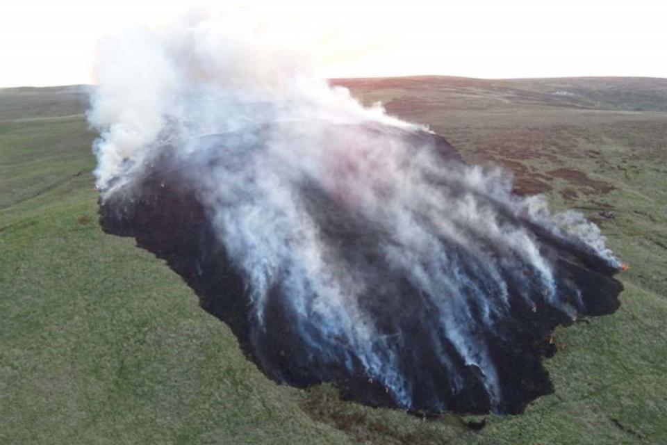 The moorland fire consumed more than 5km of land by 6pm on Sunday (PA)