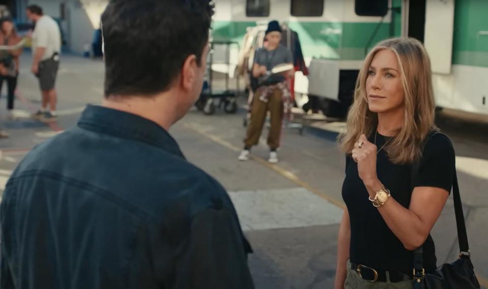 PHOTO: Jennifer Anniston speaks with Dave Schwimmer in the new Uber Eats Super Bowl commercial. (Uber Eats/YouTube)
