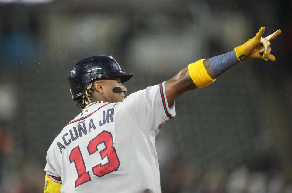 Atlanta Braves' Ronald Acuna Jr. gestures as he circles the bases after hitting a two-run home run off Colorado Rockies relief pitcher Karl Kauffmann in the fifth inning of a baseball game Monday, Aug. 28, 2023, in Denver. (AP Photo/David Zalubowski)