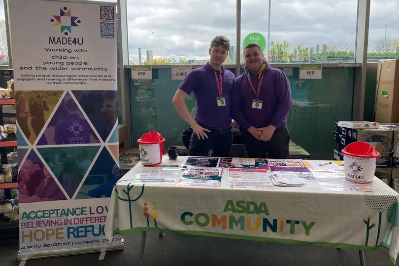 Staff members Ronnie Jamieson and Scott Wilson set up a stall at ASDA in Wishaw -Credit:Made4U in ML2