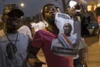 People celebrate the inauguration of new Gambia's President Adama Barrow at Westfield neighbourhood on January 19, 2017 in Banjul