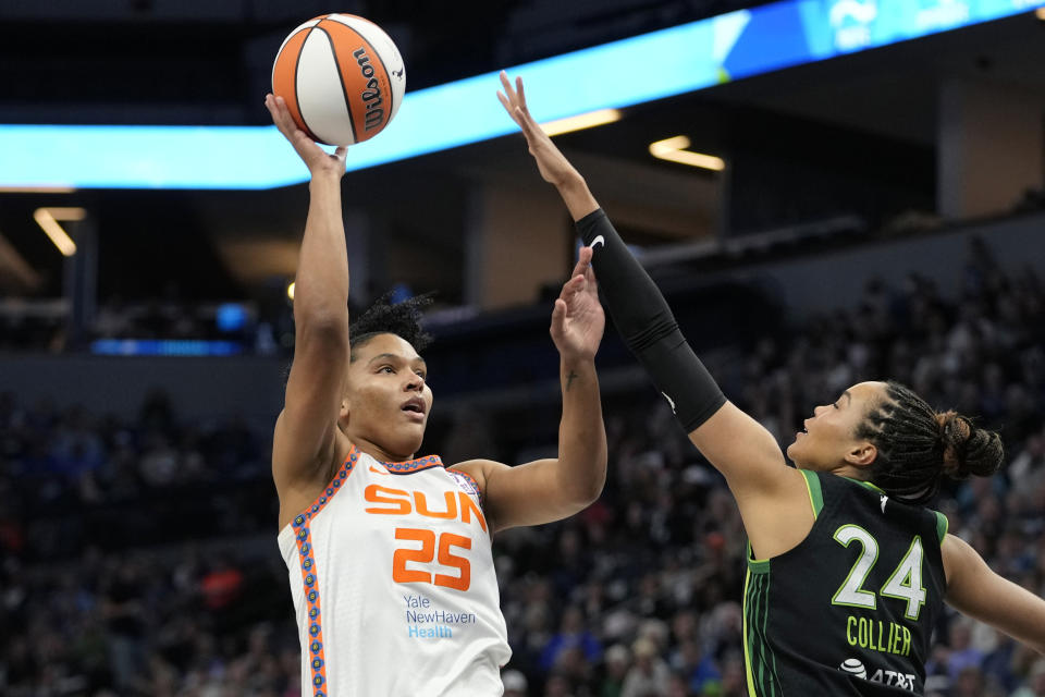 Connecticut Sun forward Alyssa Thomas (25) shoots over Minnesota Lynx forward Napheesa Collier (24) during the first half of Game 5 of a WNBA basketball semifinals, Tuesday, Oct. 8, 2024, in Minneapolis. (AP Photo/Abbie Parr)