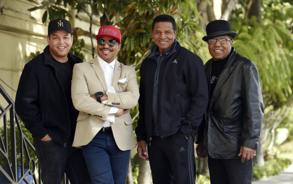 In this Tuesday, Feb. 26, 2019 photo, Marlon Jackson, second from left, Jackie Jackson, second from right, and Tito Jackson, far right, brothers of the late singer Michael Jackson, and Tito's son Taj, far left, pose together for a portrait outside the Four Seasons Hotel, in Los Angeles. Jackson's brothers gave the first family interviews Tuesday on “Leaving Neverland,” which features two Michael Jackson accusers and is set to air on HBO starting Sunday, March 3. (Photo by Chris Pizzello/Invision/AP)