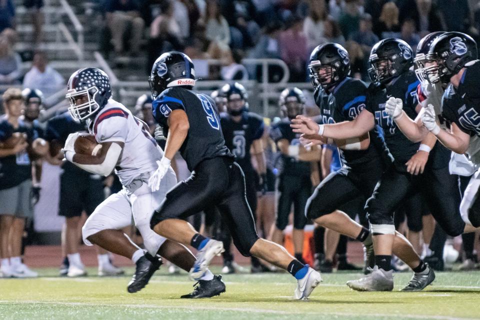 Central Bucks East running back Ethan Shine picks up yardage during the Patriots' 21-7 victory over Central Bucks South.