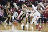 Indiana's Jalen Hood-Schifino (1) makes a steal against Purdue's Braden Smith, front left, during the second of an NCAA college basketball game, Saturday, Feb. 4, 2023, in Bloomington, Ind. (AP Photo/Darron Cummings)