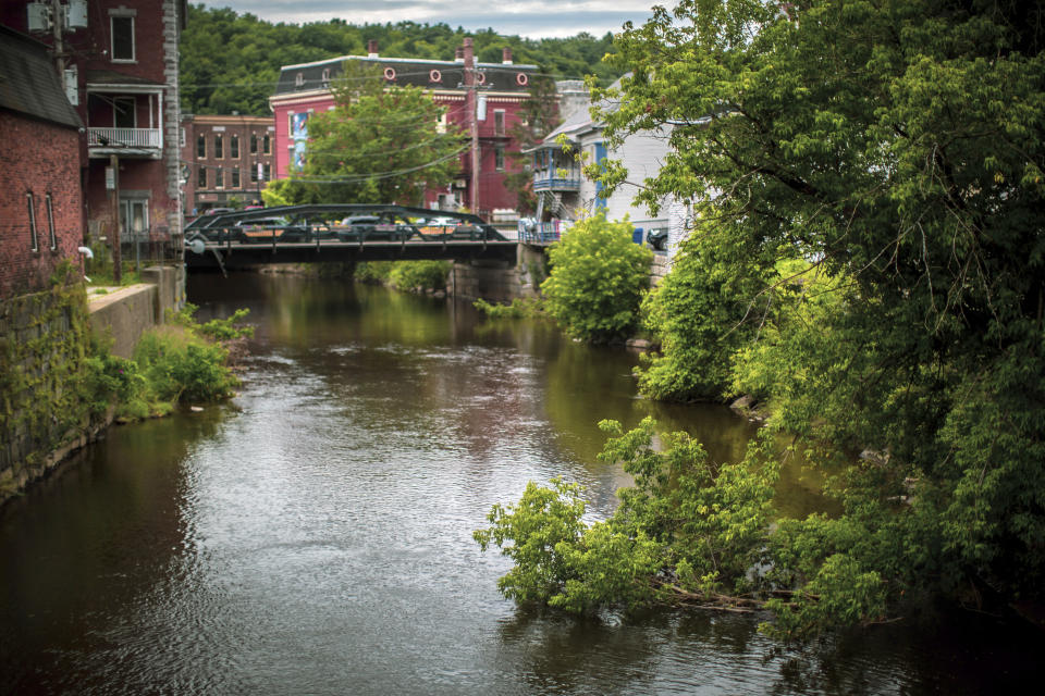 The Winooski River runs through Montpelier, Vt. in this July 3 2024 photo. The river has flooded the state's capital in 2023 causing massive damages. A year after catastrophic flooding inundated parts of Vermont, some homeowners are still in the throes of recovery. (AP Photo/ Dmitry Belyakov)