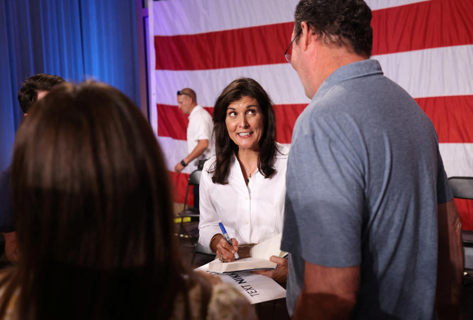 Former U.S. Ambassador to the U.N. and Republican presidential candidate Nikki Haley speaks with a supporter following a town hall in Indian Land, S.C.