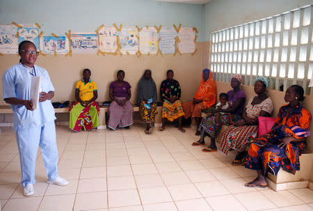 A nurse from Marie Stopes NGO talks to women during a family planning course at a dispensary in the village of Nedgo, near Ouagadougou, Burkina Faso February 16, 2018. REUTERS/Luc Gnago