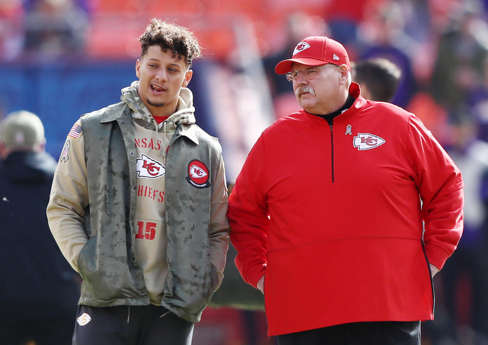 Patrick Mahomes talks with Chiefs coach Andy Reid before last week's game against the Minnesota Vikings. (Getty Images)