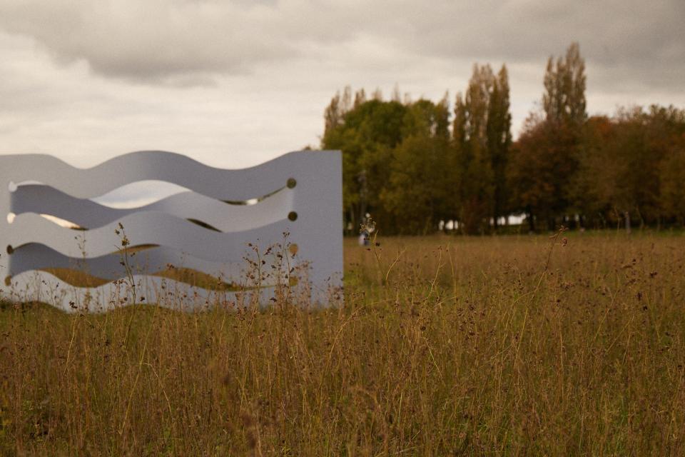 A work in steel by Pierre Tual sits in the field in front of Soisay.
