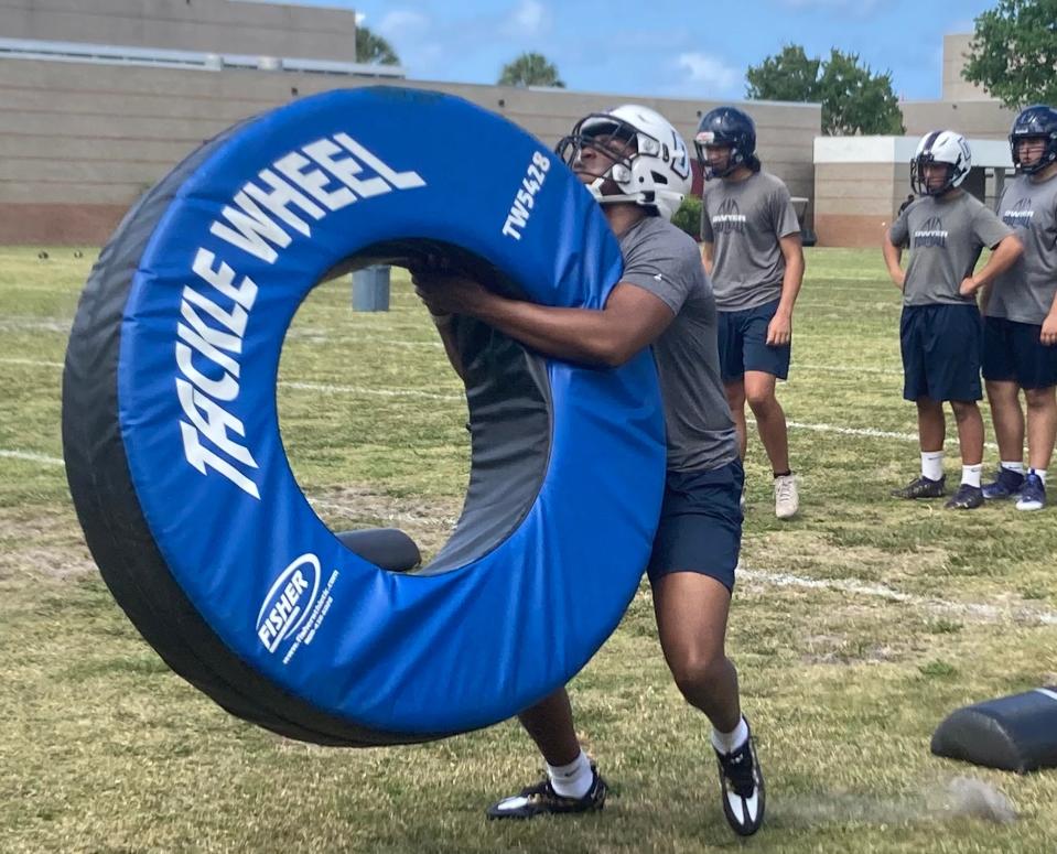 Dwyer High School rising senior edge rusher Kerrington Lee during tackling drills in practice on Monday. Lee is No. 80 on the USA Today Florida Network pre-spring top 100.