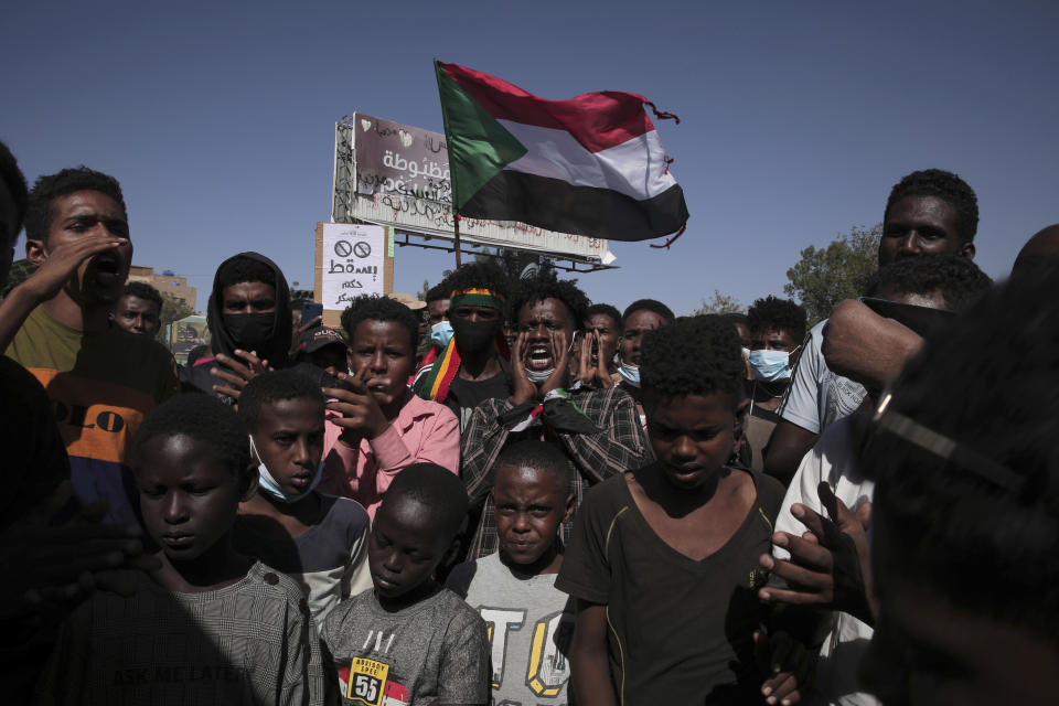 Thousands of protesters take to the streets to renew their demand for a civilian government in the Sudanese capital Khartoum, Thursday, Nov. 25, 2021. The rallies came just days after the military signed a power-sharing deal with the prime minister, after releasing him from house arrest and reinstating him as head of government. The deal came almost a month after the generals orchestrated a coup. Sudan’s key pro-democracy groups and political parties have dismissed the deal as falling short of their demands for a fully civilian rule. (AP Photo/Marwan Ali)