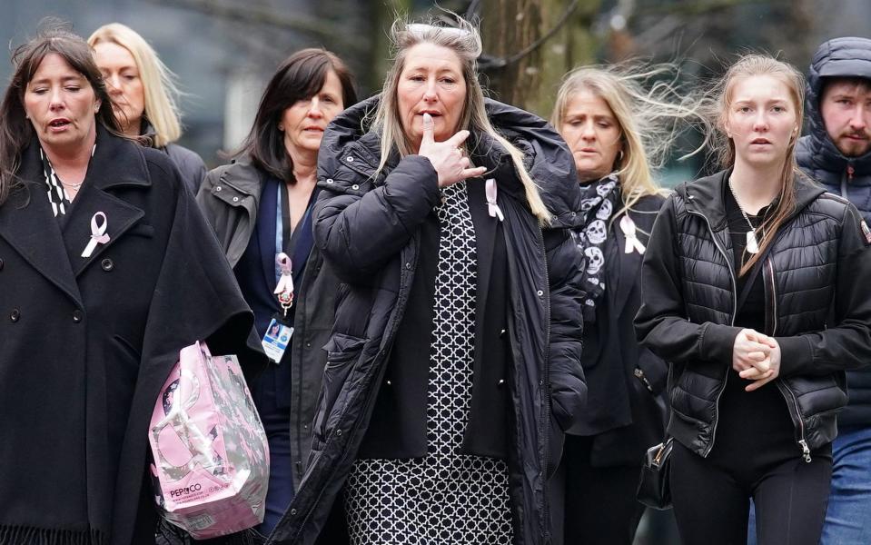 Cheryl Korbel (centre), the mother of Olivia - PA