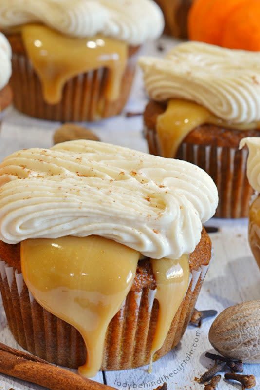 <p>Lady Behind the Curtain</p><p>Cupcakes are filled with pumpkin and espresso powder, a layer of caramel, topped with pumpkin spice latte frosting. </p><p><strong>Get the recipe:</strong><strong> <a href="https://www.ladybehindthecurtain.com/pumpkin-spice-caramel-latte-cupcakes/" rel="nofollow noopener" target="_blank" data-ylk="slk:Pumpkin Spice Caramel Latte Cupcakes;elm:context_link;itc:0;sec:content-canvas" class="link ">Pumpkin Spice Caramel Latte Cupcakes</a></strong></p>