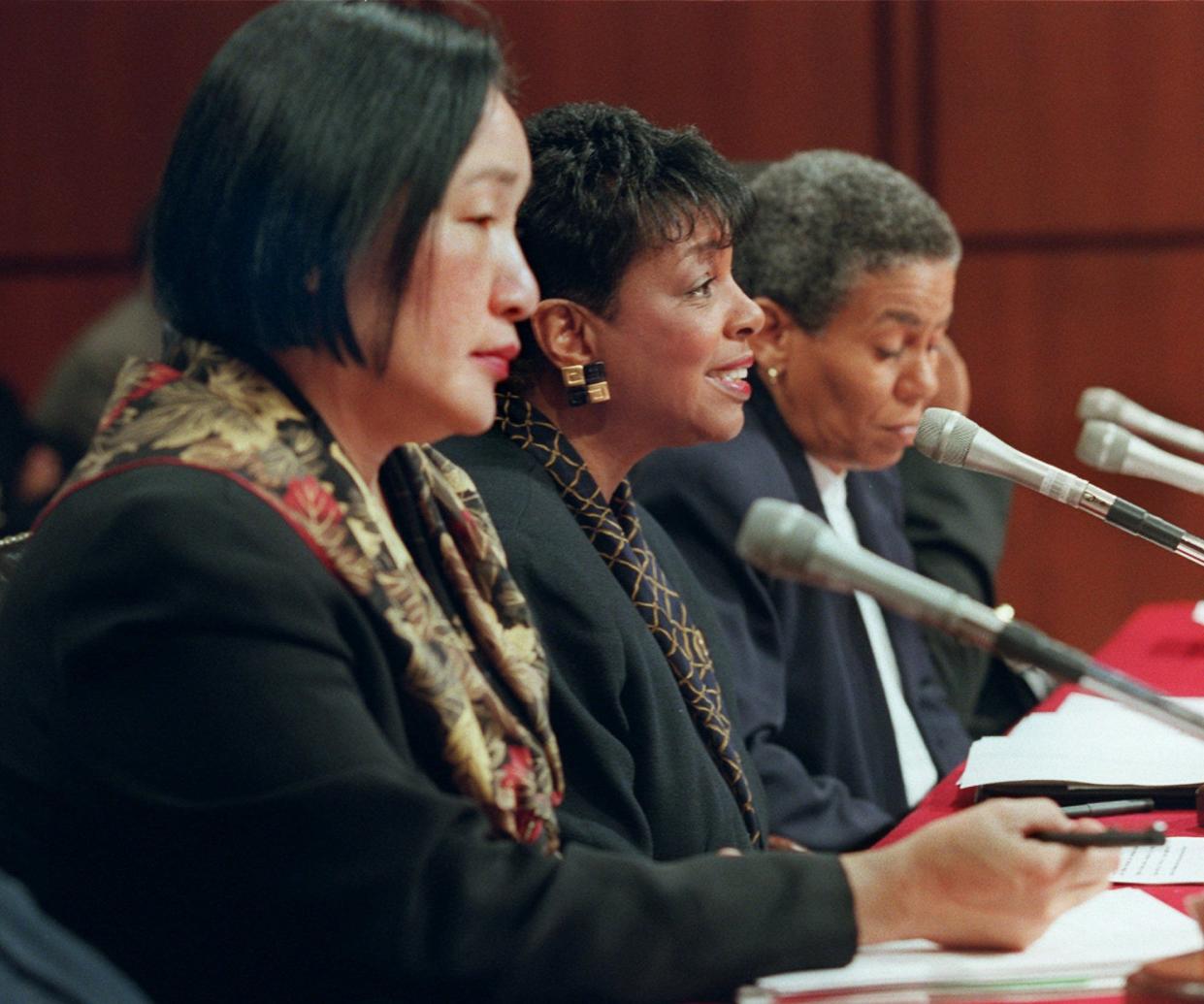 Carolyn Getridge, superintendent, Oakland Unified School District, center, testifies on Capitol Hill Thursday Jan. 23, 1997 before a Senate Appropriations subcommittee hearing on Ebonics. Jean Quan, board president, Oakland Unified School District, left, and Toni Cook of the Oakland Board of Education, right, wait to testify. 