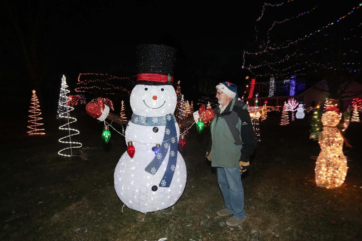 Dan Rambacher in front of his home in Sagamore Hills. The Rambachers raised over $37,000 for St. Jude's Hospital in donations from admirers of their Christmas light display in 2022.