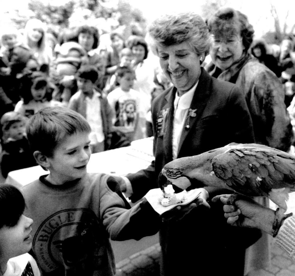 Robby Burroway, 6, Sacramento, feeds birthday cake to Julio, an 8-month-old blue and gold macaw as Mayor Anne Rudin and Supervisor Illa Collin watch during 65th birthday celebration for the Sacramento Zoo on March 23, 1992.