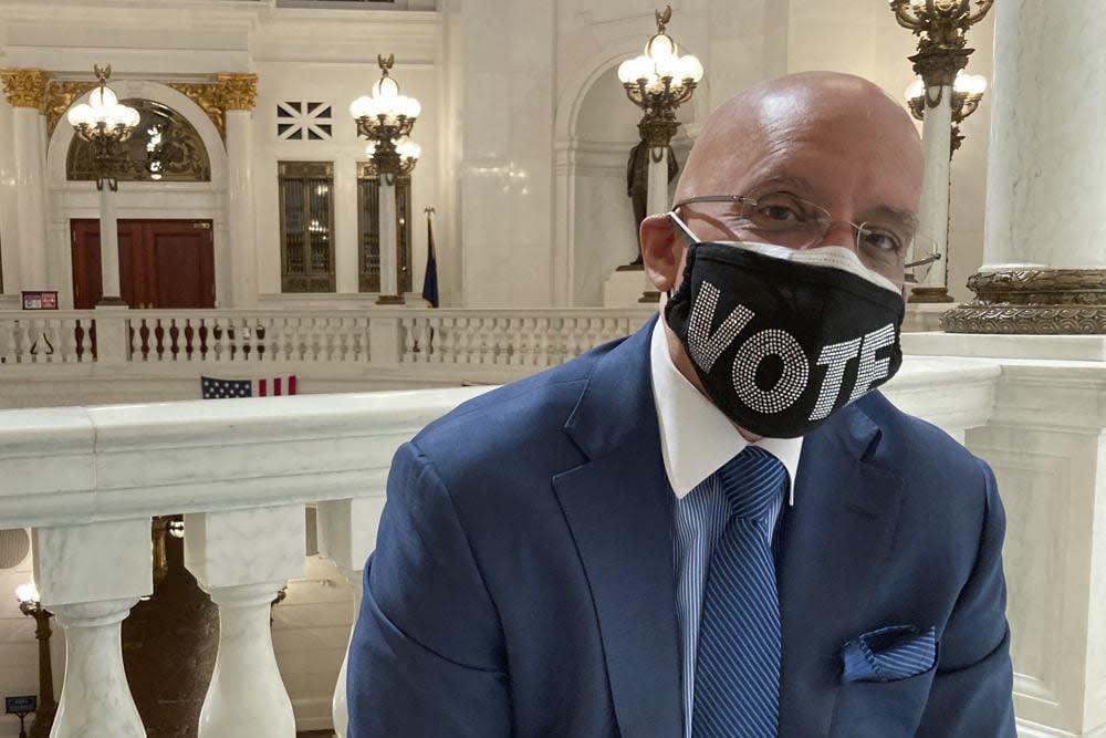 Pennsylvania state Sen. Vince Hughes, D-Philadelphia, poses in the Rotunda of the state Capitol in Harrisburg, Pa on Wednesday May 21, 2021. (AP Photo/Mark Scolforo)