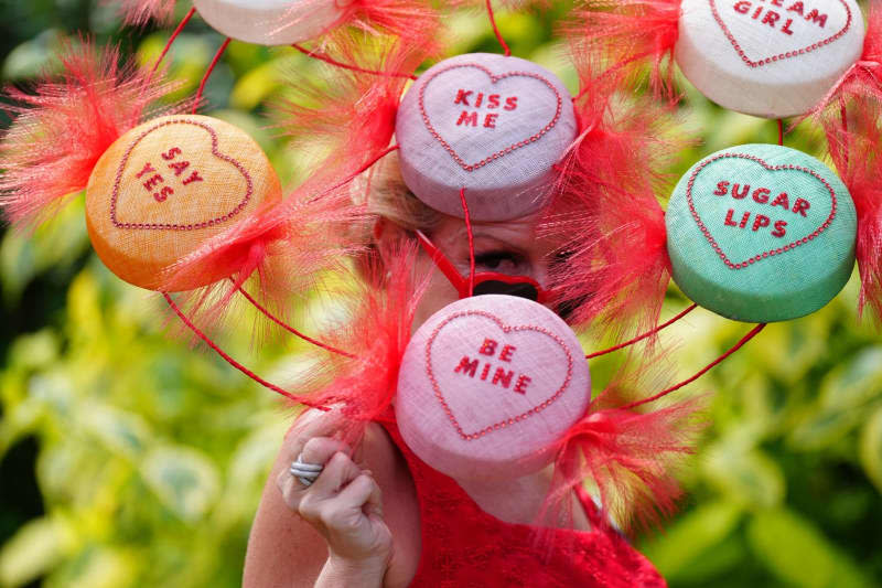 A racegoer with a Love Hearts themed hat is pictured on day one of Royal Ascot horse race at Ascot Racecourse. David Davies/PA Wire/dpa