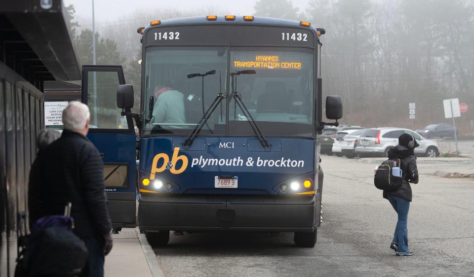 A Plymouth and Brockton bus arriving from Boston drops off morning riders at the commuter lot off Route 6 in West Barnstable.