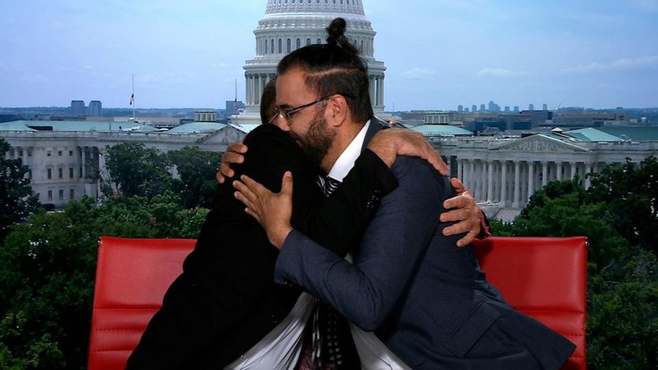 Maoz Inon and Aziz Abu Sarah embrace after speaking about their message of peace on Christiane Amanpour’s show (Image courtesy of Maoz Inon)