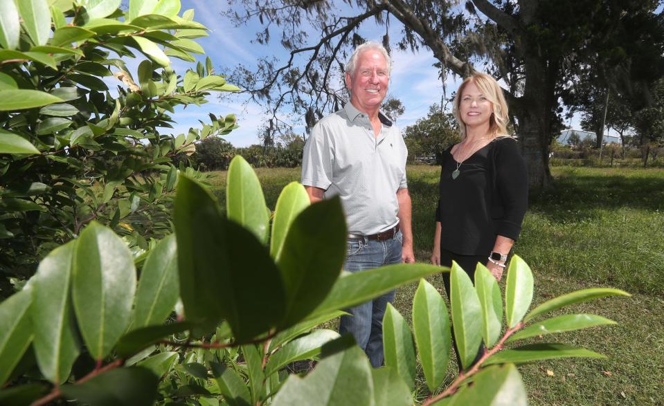 Larry Kaylor and Julie Mericle Smith stand on the former Bishops Dairy property at 490 Flomich St. in Holly Hill on Tuesday, Oct. 10, 2023. The two recently bought the 25-acre site from local businessman Robin Hanger so they can fulfill his dream of turning it into a recreational vehicle campground. They hope their planned Lake Belle RV Resort can cater in part to pickleball enthusiasts coming from all over the country to play at the Pictona pickleball complex down the street.