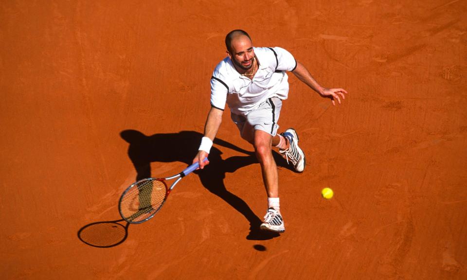 <span>Andre Agassi of the United States in action on the way to winning the French Open at Roland Garros on 6 June 1999.</span><span>Photograph: Simon M Bruty/Getty Images</span>