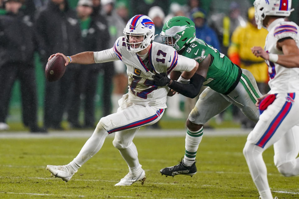 Buffalo Bills quarterback Josh Allen is tackled by Philadelphia Eagles linebacker Zach Cunningham during the first half of an NFL football game Sunday, Nov. 26, 2023, in Philadelphia. (AP Photo/Chris Szagola)