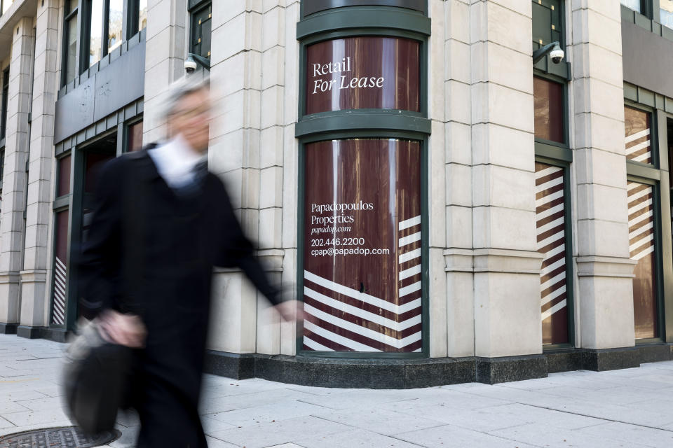 A retail for lease sign on a building in Washington.