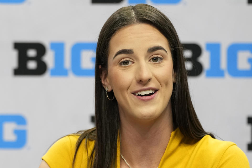 FILE - Iowa's Caitlin Clark answers questions during Big Ten NCAA college basketball Media Days Monday, Oct. 9, 2023, in Minneapolis. While teams like Tennessee and UConn would draw huge crowds on the road in the past and South Carolina has had a strong fan base the last few years, there's never been anything like it in women's basketball when an individual player has drawn so much interest from fans wanting to see her play. (AP Photo/Abbie Parr, File)