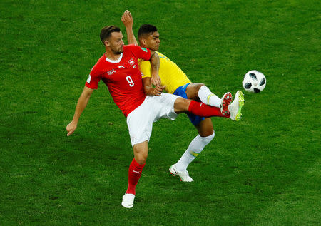 Soccer Football - World Cup - Group E - Brazil vs Switzerland - Rostov Arena, Rostov-on-Don, Russia - June 17, 2018 Brazil's Casemiro in action with Switzerland's Haris Seferovic REUTERS/Jason Cairnduff